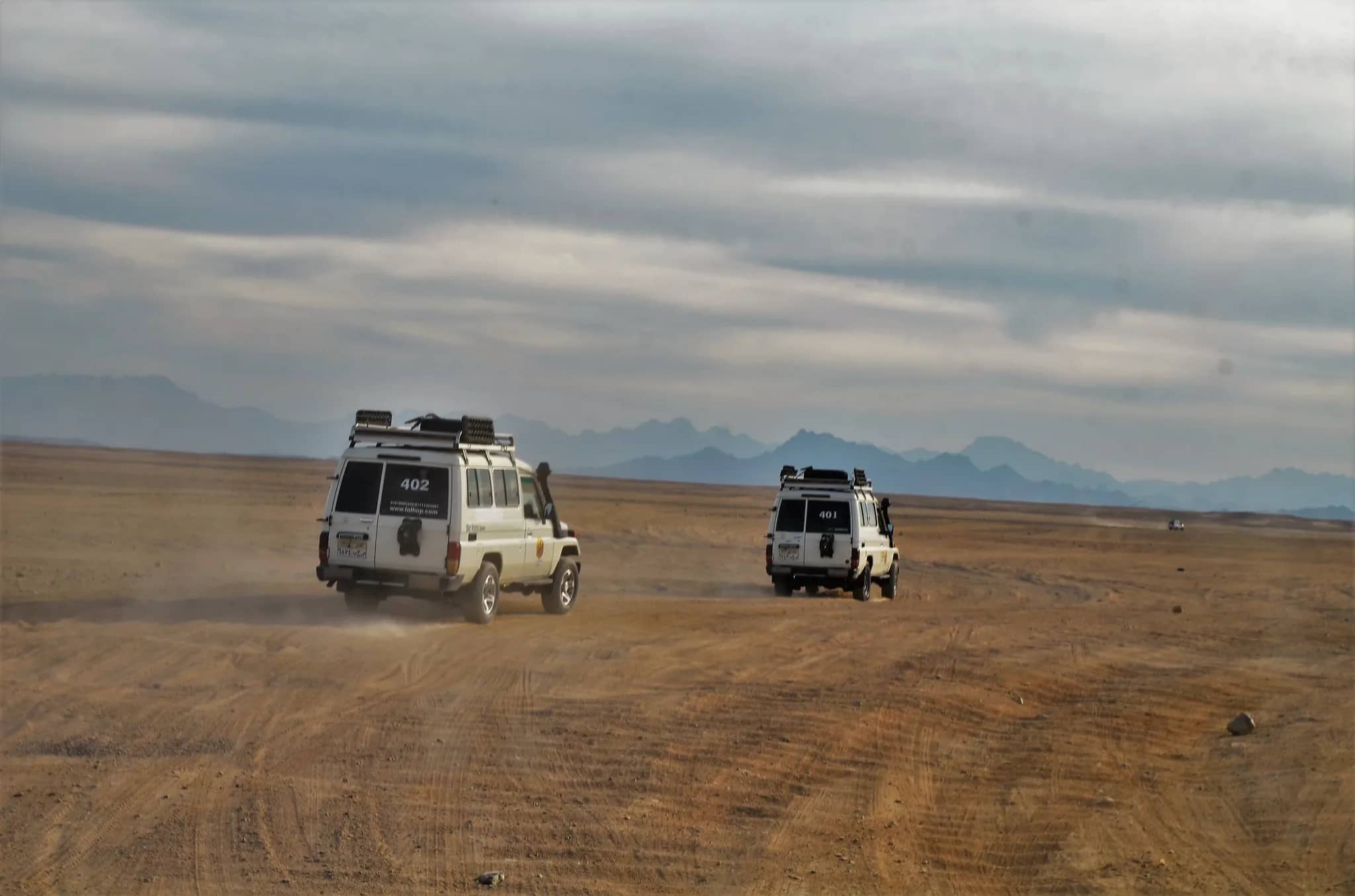Guests riding quad bikes during a Hurghada Super Safari desert tour