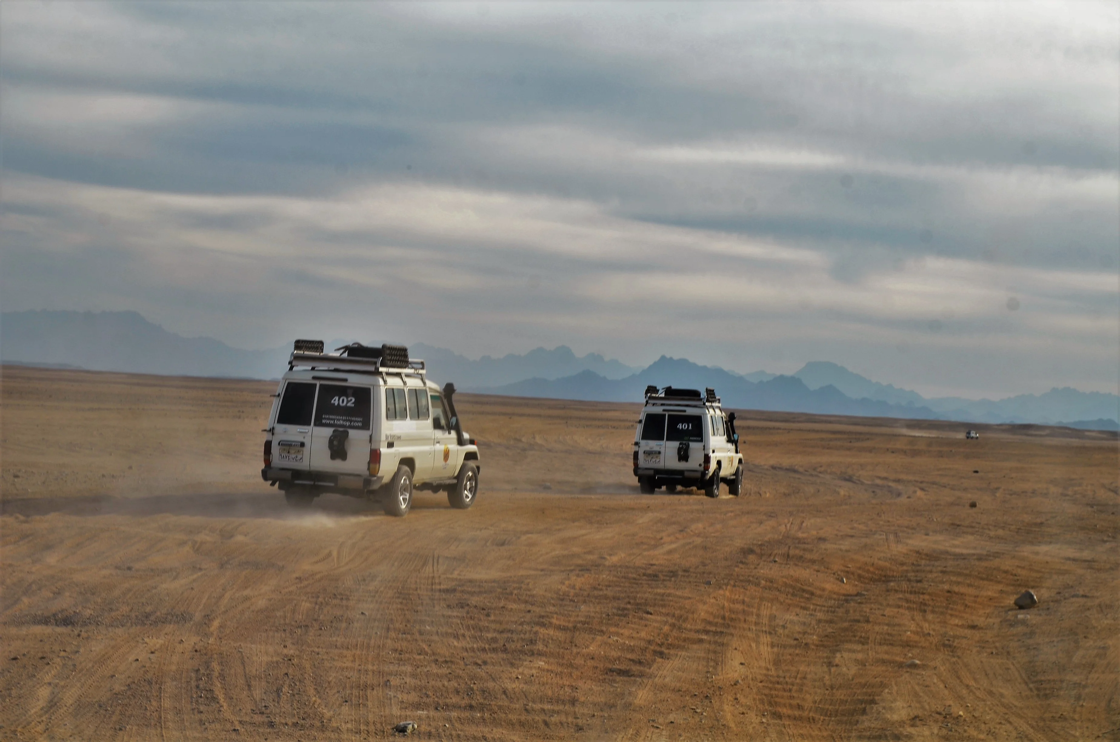 Guests riding quad bikes during a Hurghada Super Safari desert tour