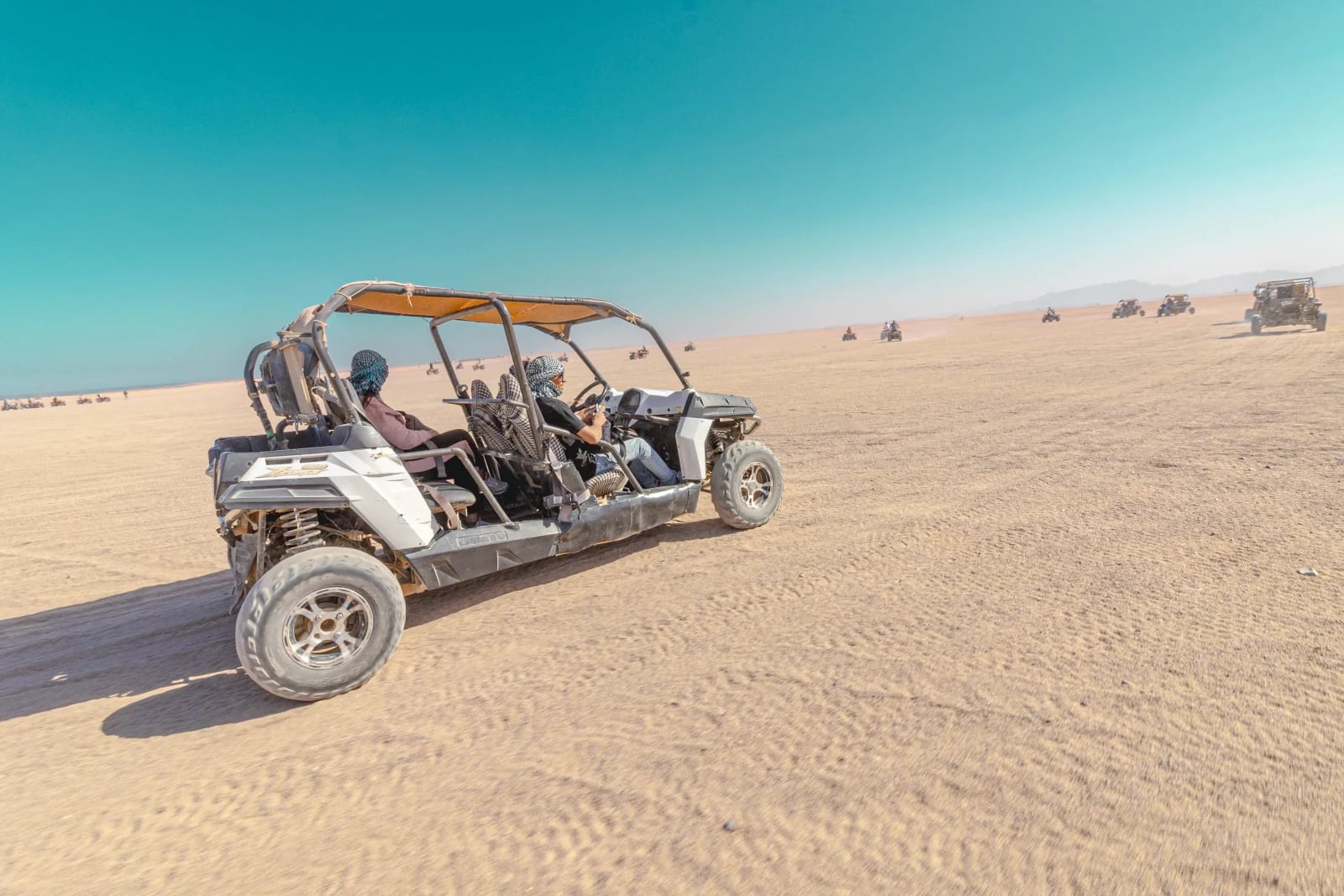 Private 4x4 jeep parked in the Hurghada desert at golden hour